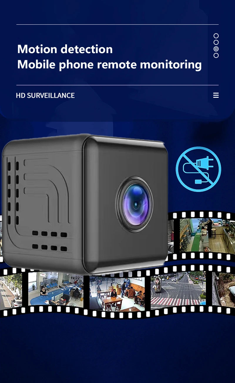 Small, black cube-shaped wireless indoor security camera with a central lens, featuring motion detection capabilities.
