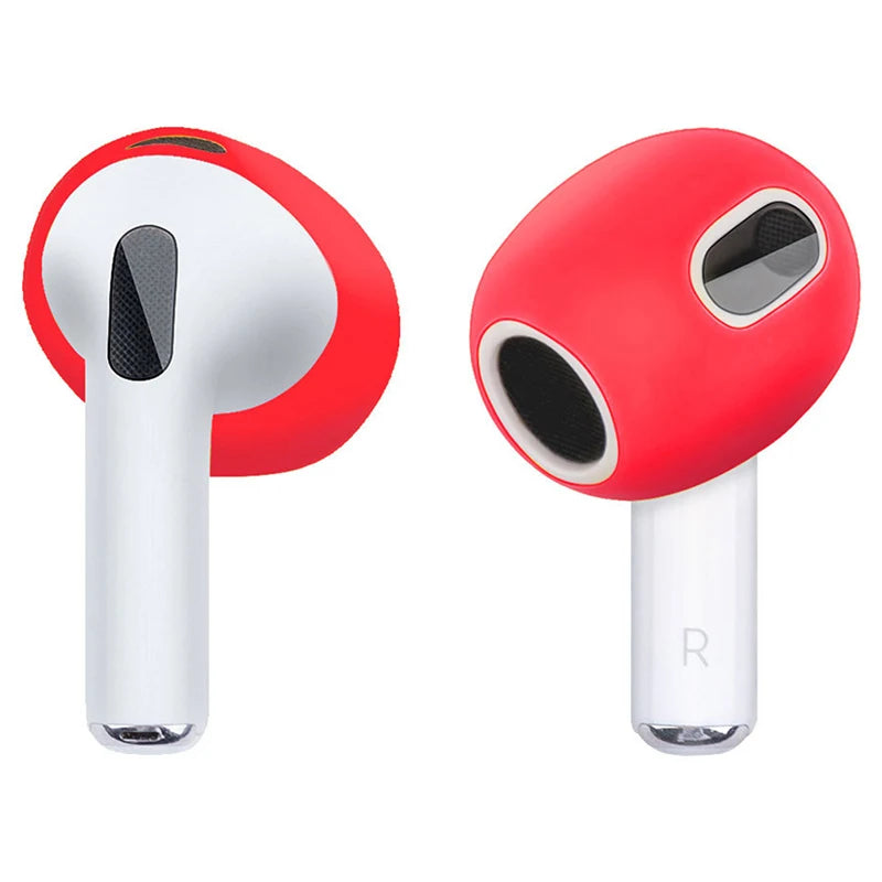 Bright red silicone skin covers for AirPods 3, showcasing a snug, protective fit on white earbuds.
