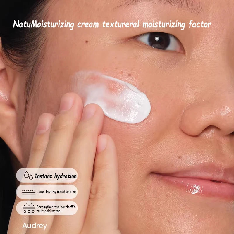 A close-up of a person applying smooth, white moisturizing cream to their cheek for instant hydration and barrier care.