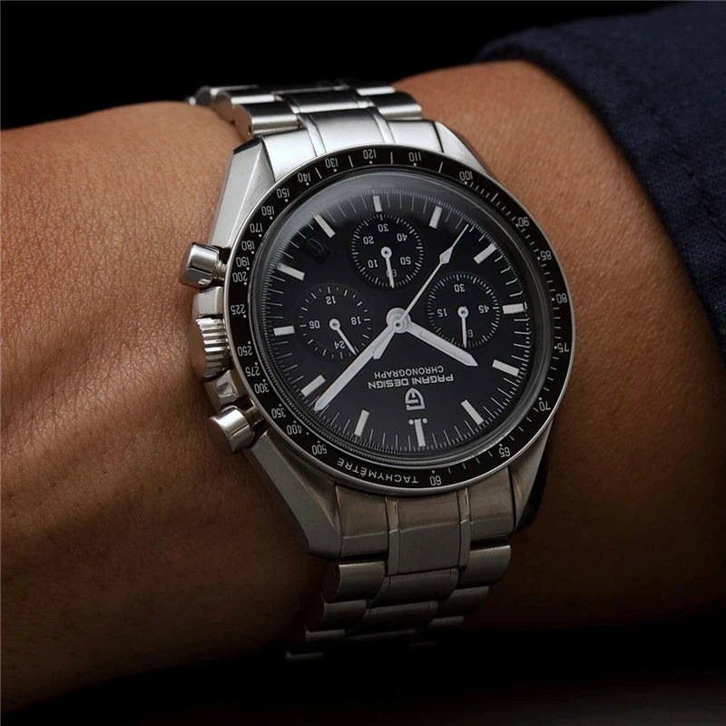 Pagani Design silver-tone stainless steel chronograph watch with a black dial and tachymeter bezel on a wrist.