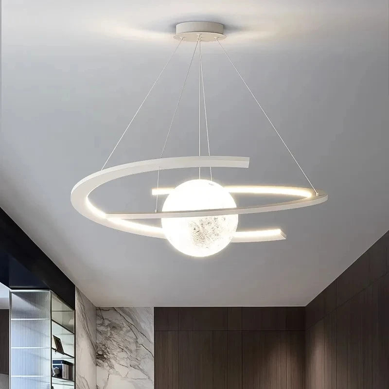 Modern white pendant light featuring a central illuminated globe orb suspended within a circular LED ring frame.