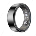 Sleek black metallic smart health ring with an inner sensor array and charging contact, shown at an angle.