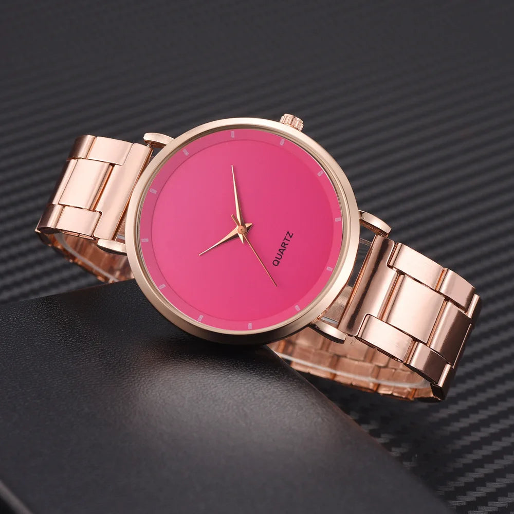 Ladies' rose gold stainless steel watch featuring a vibrant pink dial and minimalist analogue face.