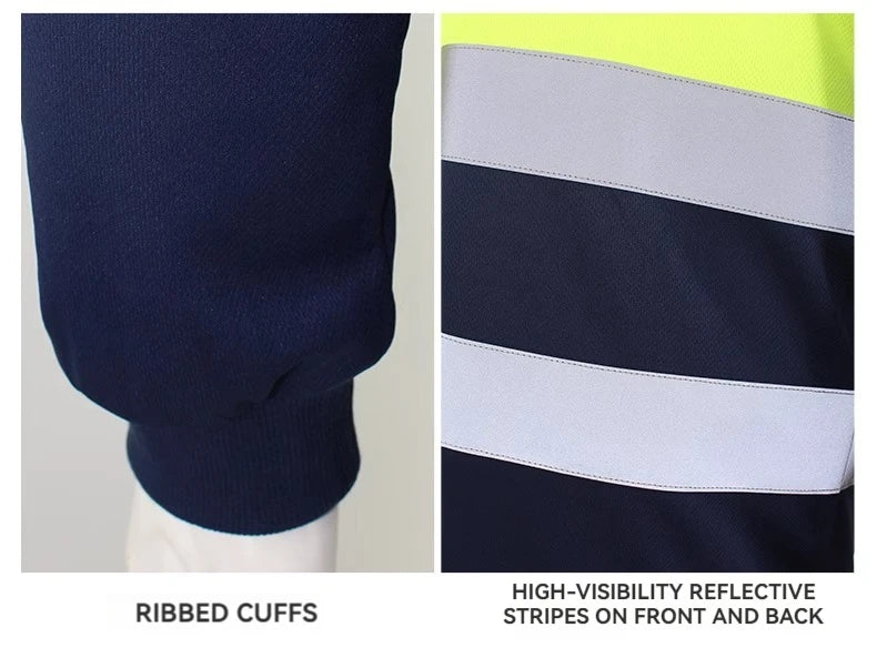 Close-up of navy hi-vis work shirt featuring ribbed cuffs and bright yellow panels with reflective safety stripes.