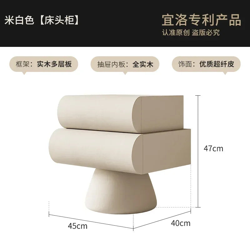 Modern, cream-coloured bedside table with two drawers, featuring a unique curved design on a sturdy pedestal base.