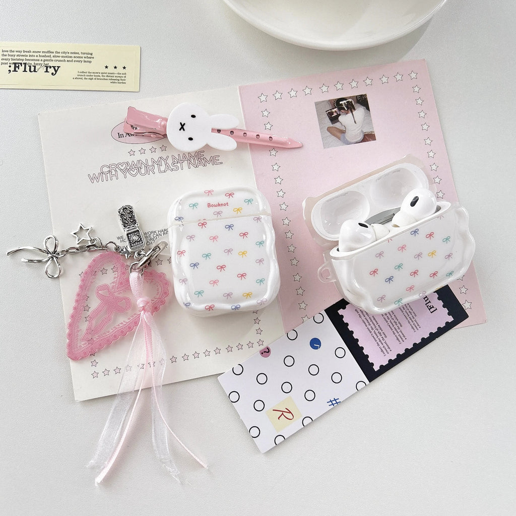 Clear AirPod case with colourful bow pattern and wavy edges. Compatible with AirPods Pro and standard models.