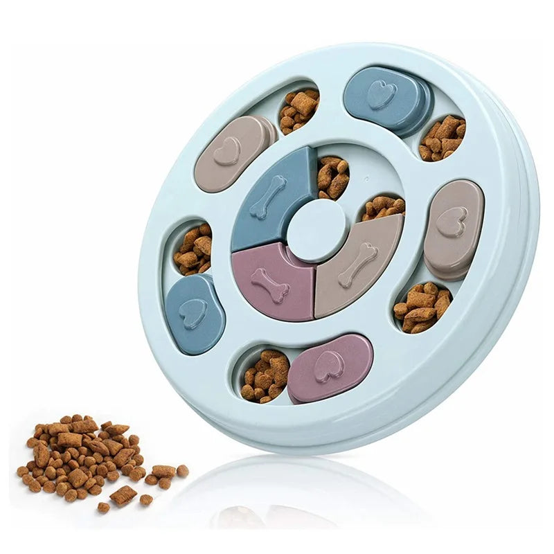 Pastel blue interactive dog puzzle feeder with colourful sliding compartments and bone-shaped treat hideaways.