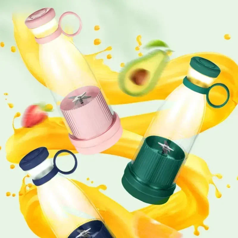 Three portable blender bottles in pink, green, and dark blue with carrying rings, set against a splashing fruit background.