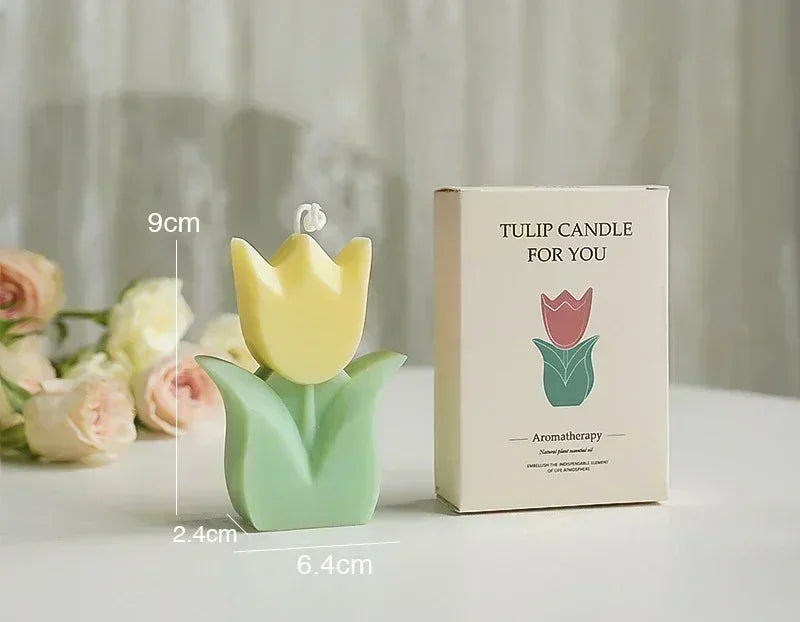 Yellow tulip-shaped aromatherapy candle with green leaves and matching gift box, 9cm tall.