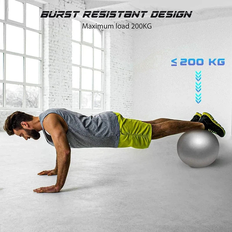 A man performing a plank with feet on a burst-resistant silver exercise ball in a gym setting. Max load 200kg.
