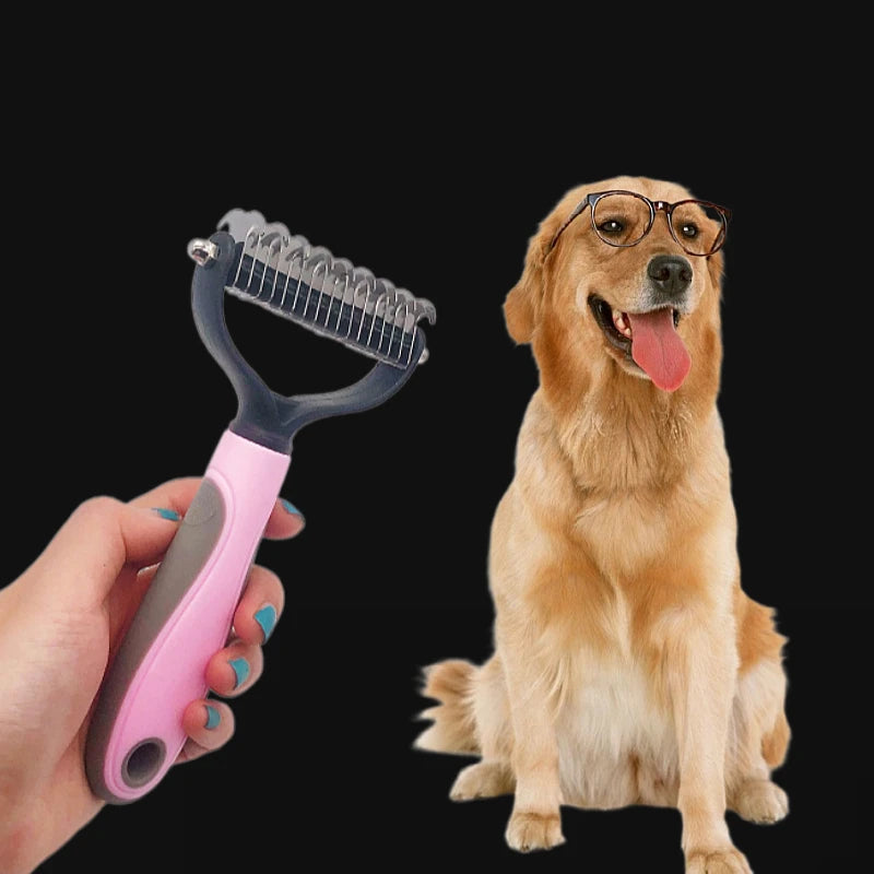 A hand holds a pink and grey pet de-shedding rake next to a golden retriever wearing glasses.