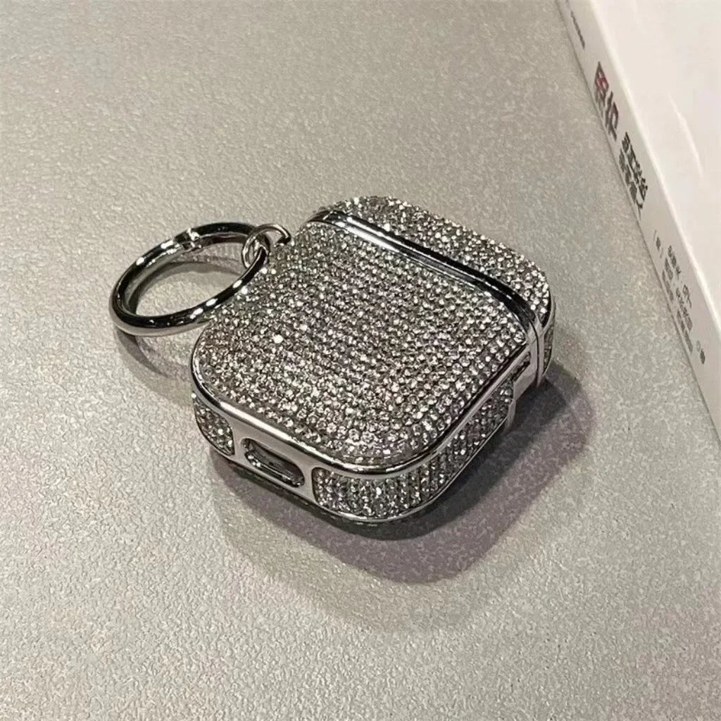 Silver glittery crystal AirPods case with a keychain ring, compatible with AirPods Pro models.