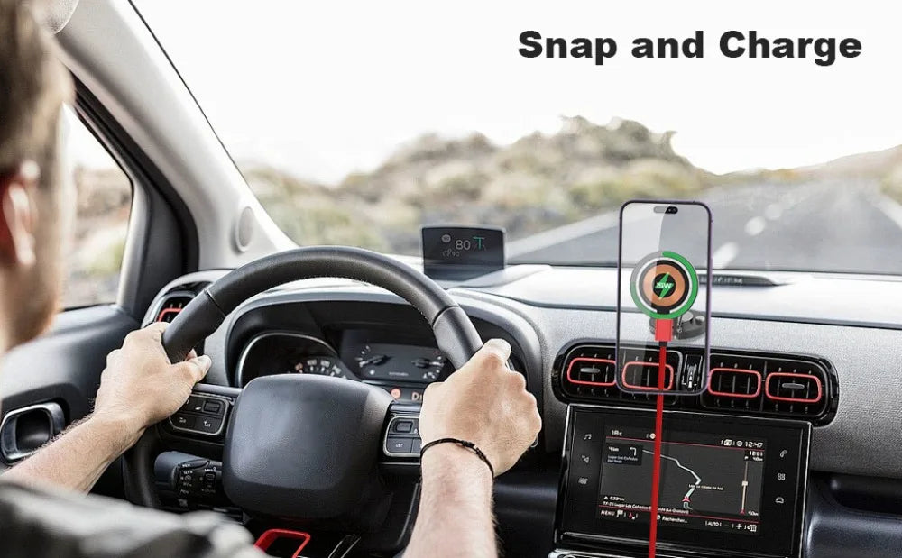 Black magnetic car phone mount attached to an air vent, holding a smartphone with a circular wireless charging icon.