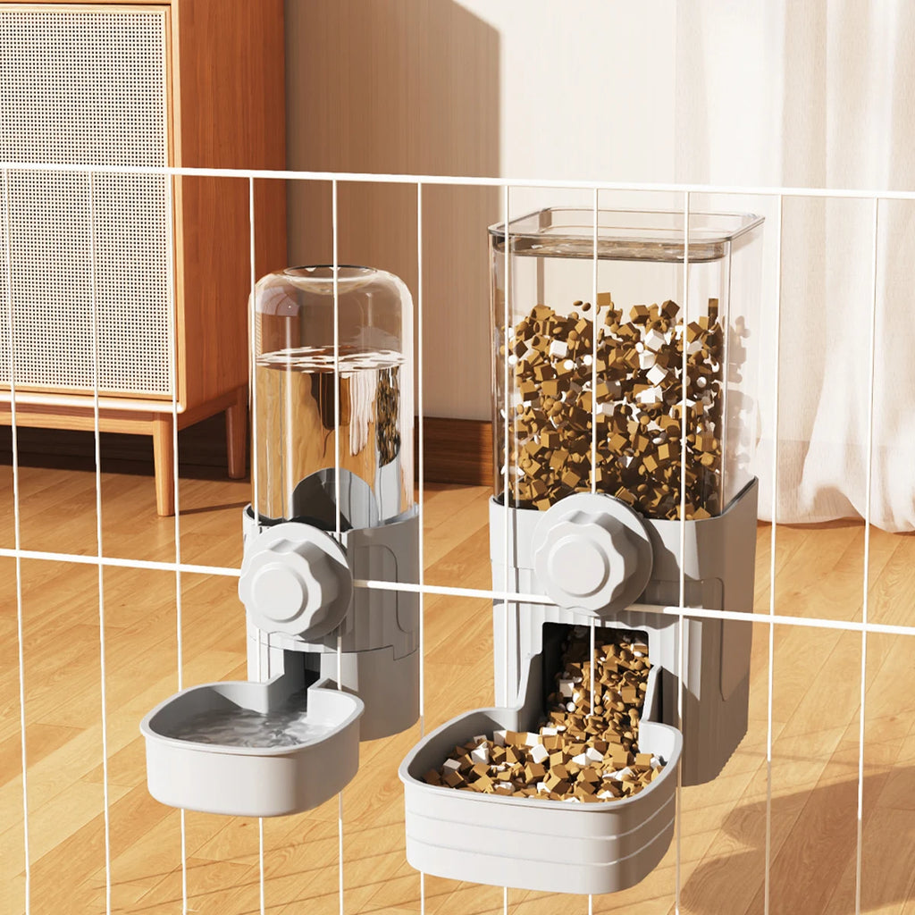 Wall-mounted grey plastic water and food dispensers for pets with clear storage containers attached to a metal cage.