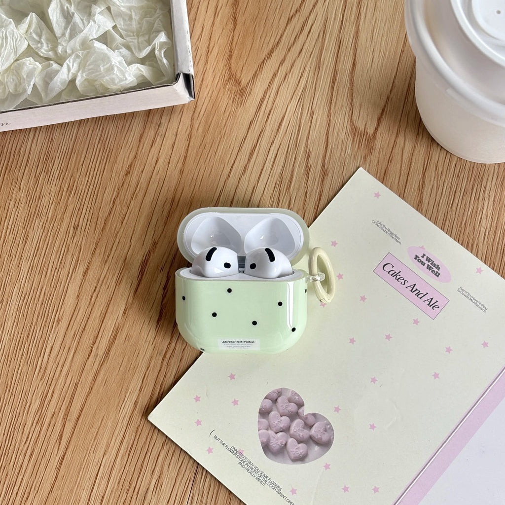 Sage green polka dot silicone AirPods case with carabiner, compatible with Apple AirPods.