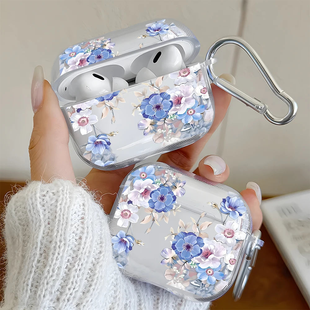 Clear AirPods Pro case with a blue and purple floral design, featuring a silver carabiner clip.