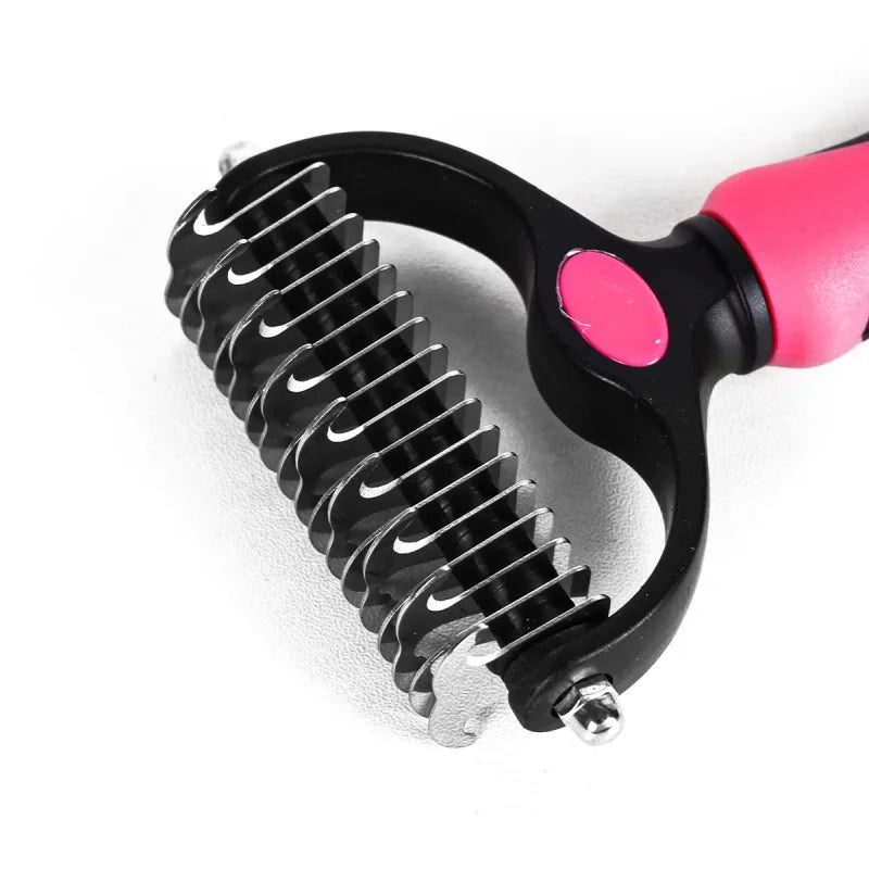 Pink and black pet grooming dematting tool with double-sided serrated stainless steel metal blades.