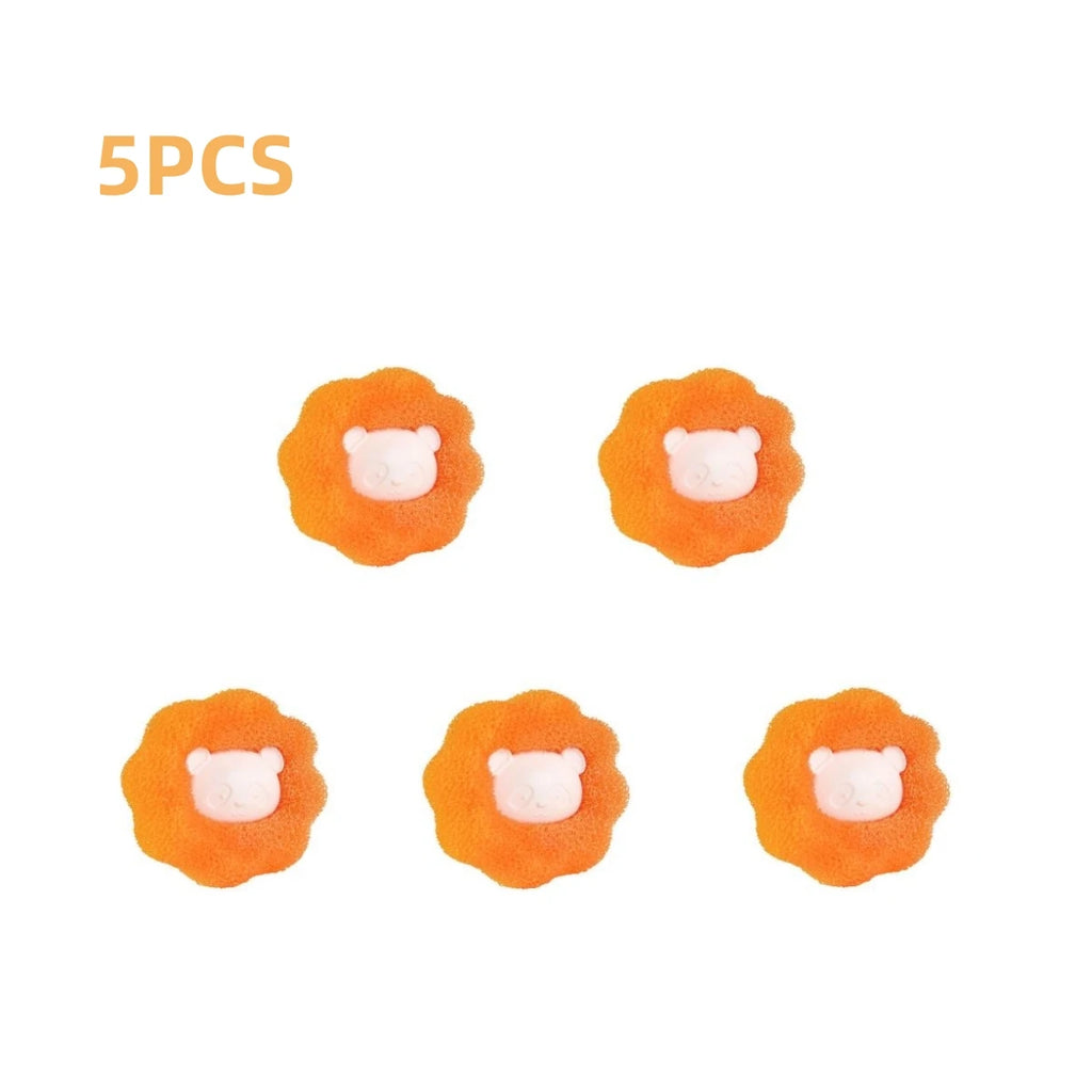 Five orange flower-shaped hair sponges with cute white bear faces in the centre.