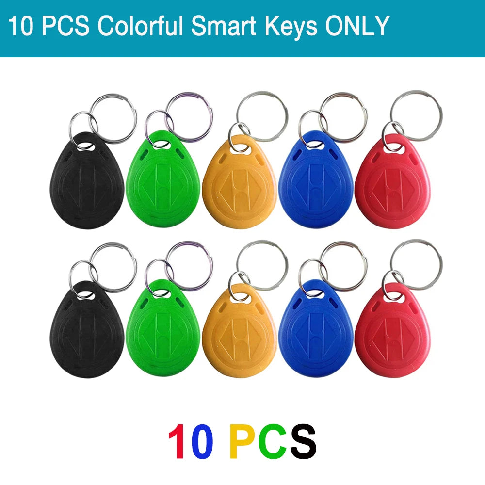 Ten colorful plastic RFID smart key fobs with metal keyring attachments in black, green, yellow, blue, and red.