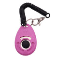 Pink, oval dog training clicker with a black push button, paw print detail, and a black coiled wrist strap.