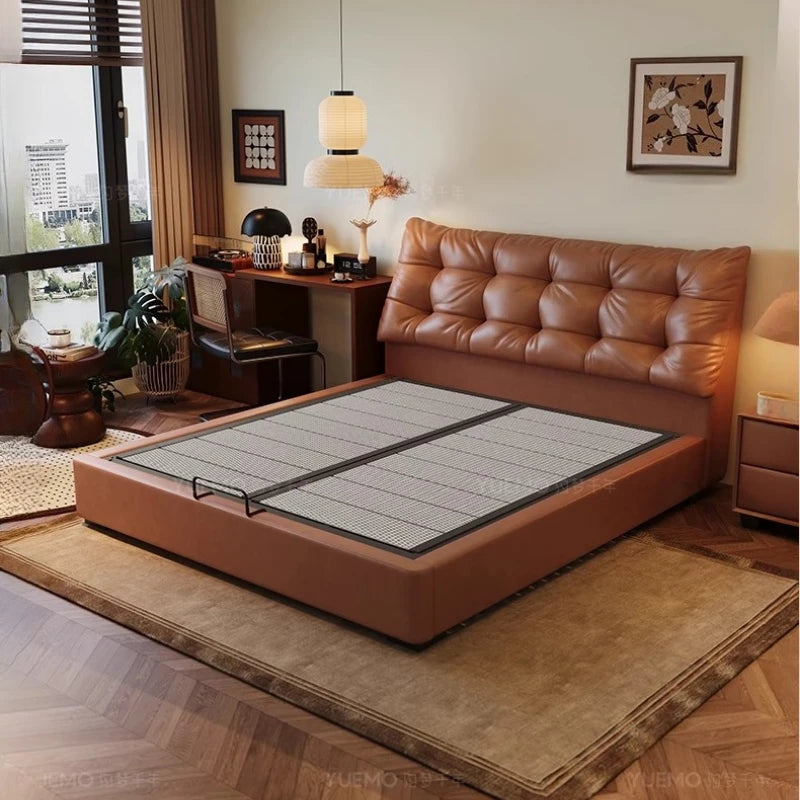 Modern Nordic double bed in tan leather with a cushioned, button-tufted headboard and a low-profile frame.