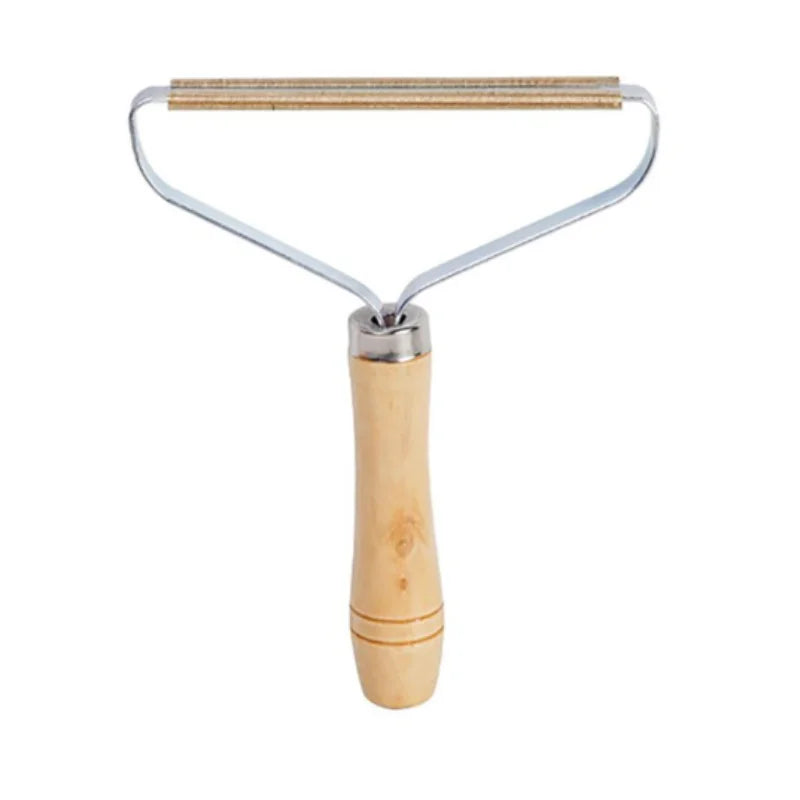Fabric lint remover with a metal scraper head and a natural light wood handle against a white background.