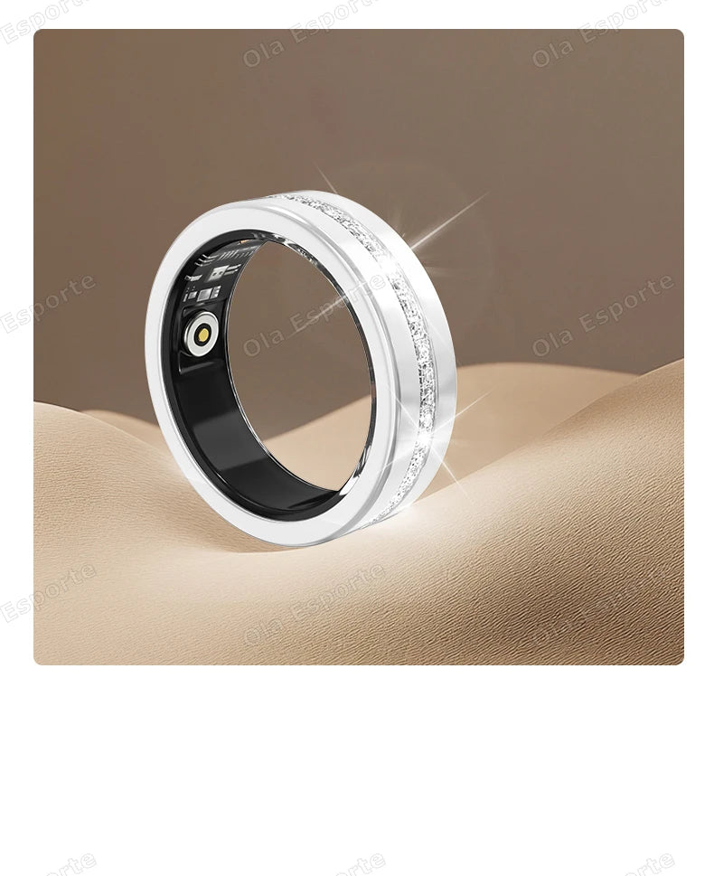 A sleek white smart fitness ring with a sparkling crystal-encrusted band, featuring internal health tracking sensors.