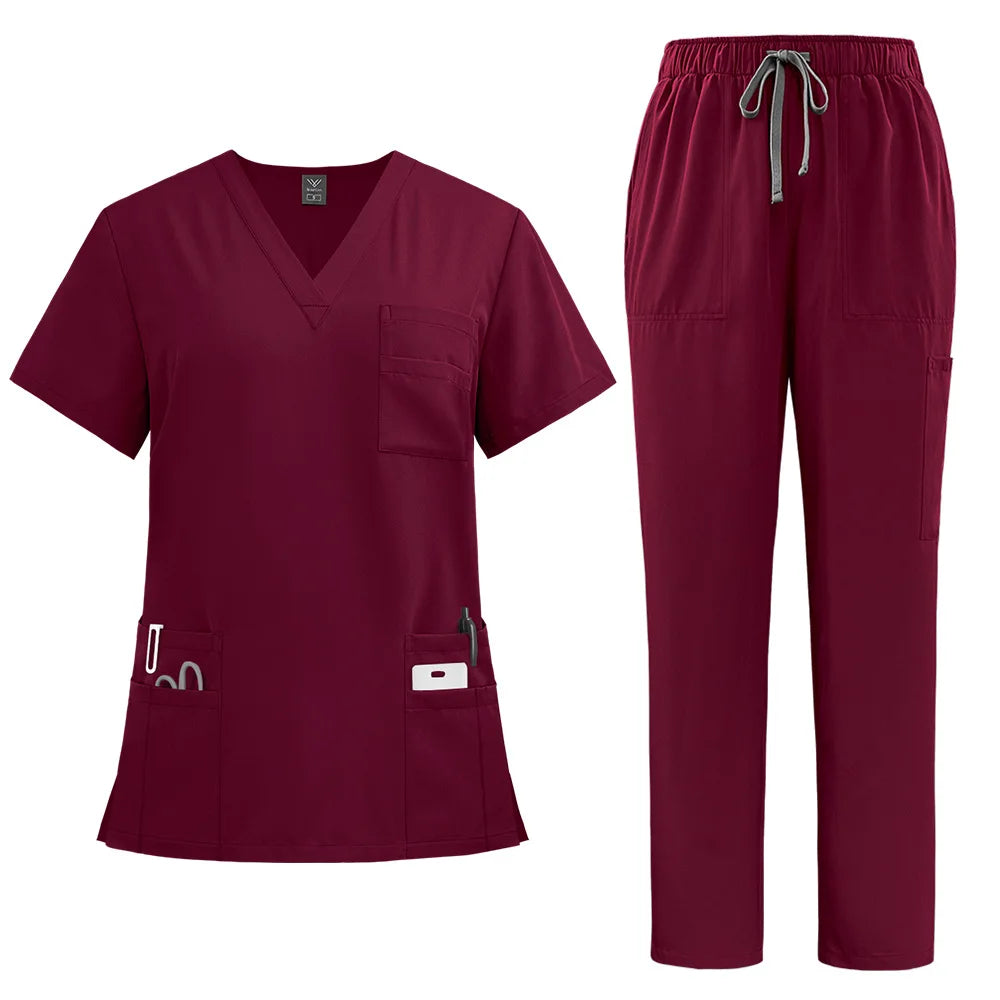 Burgundy V-neck scrub top with three pockets and matching trousers with a drawstring waist and multiple pockets.