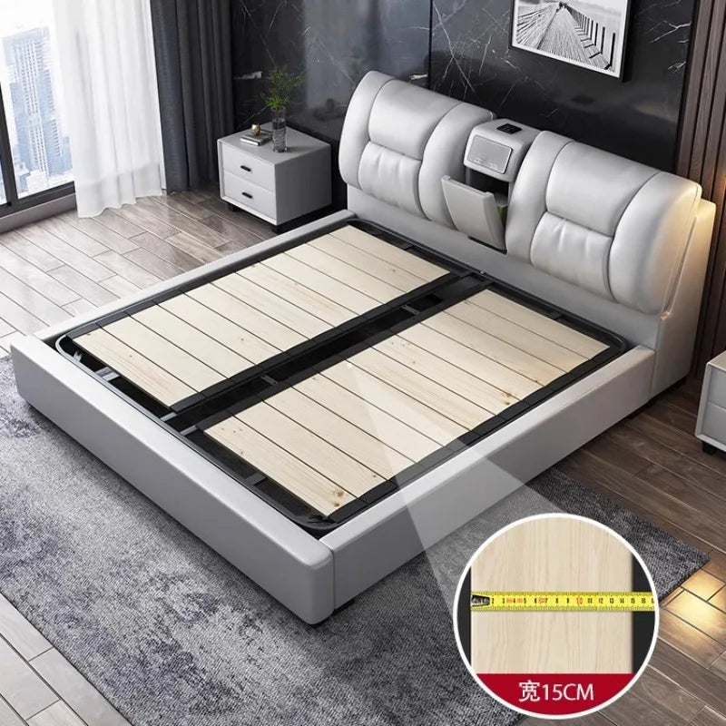 Minimalist white upholstered king bed frame with a tufted headboard, integrated storage, and sturdy wooden slat base.