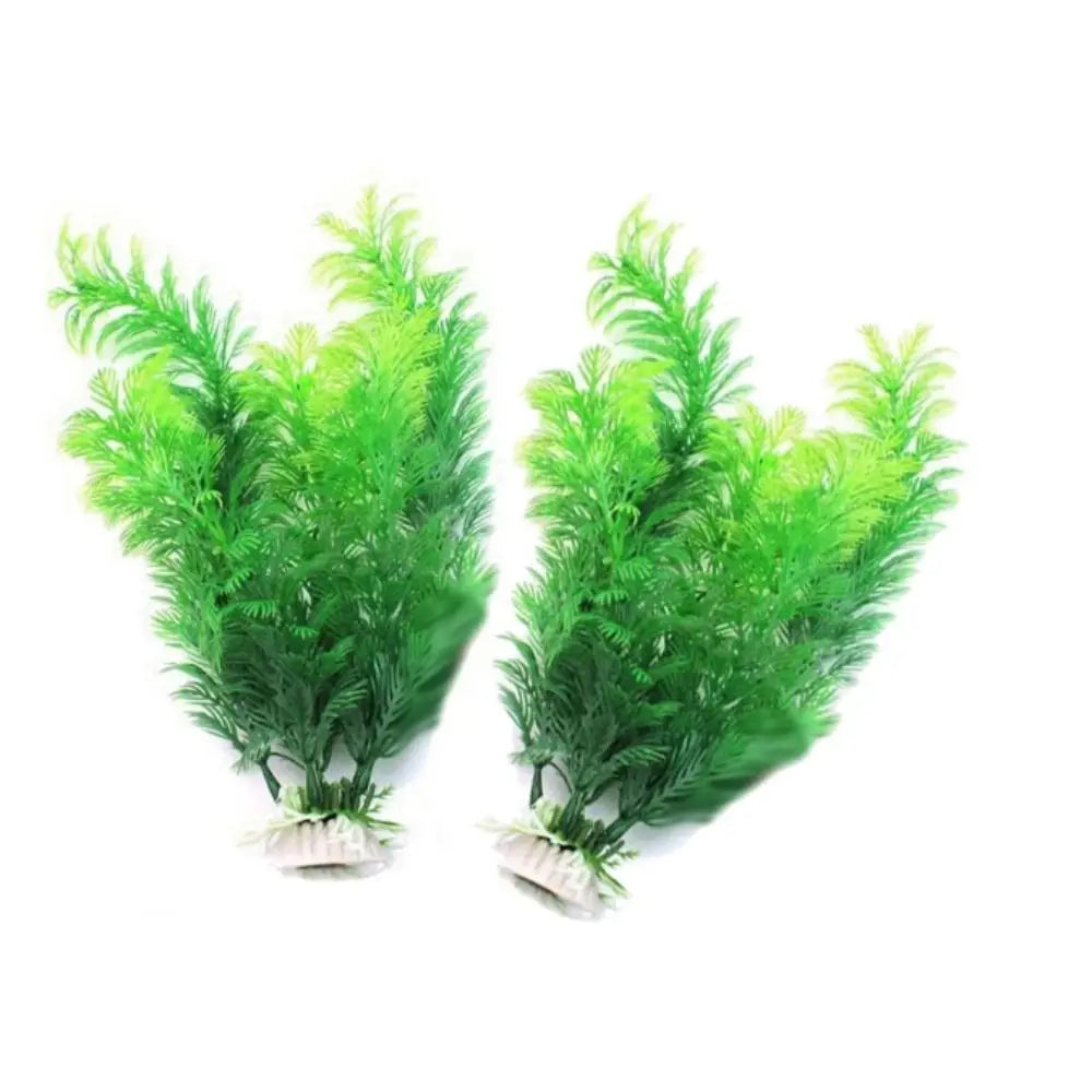 Two artificial aquarium plants with vibrant, lime-green, feathery fronds, each set in a small, white weighted base.