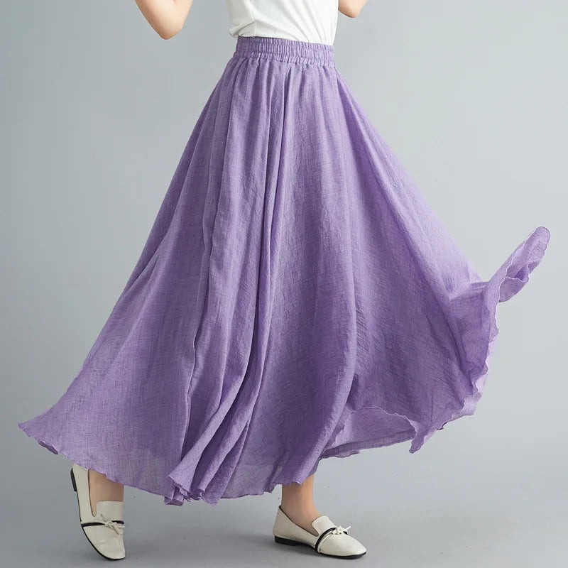 Flowing lilac maxi skirt with an elasticated waistband, crafted from a lightweight, linen-look textured fabric.