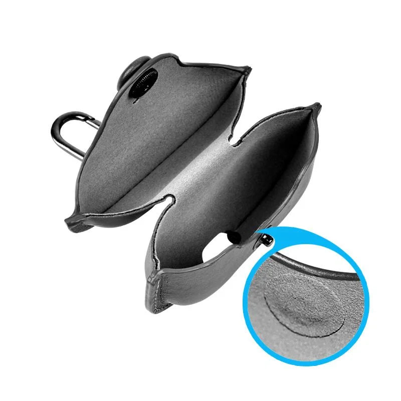 Open black leather AirPods case with metal carabiner, featuring a stud closure and soft interior lining.