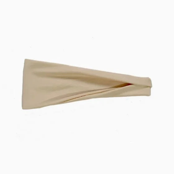 A wide, plain cream-coloured fabric headband with subtle soft folds, isolated on a white background.