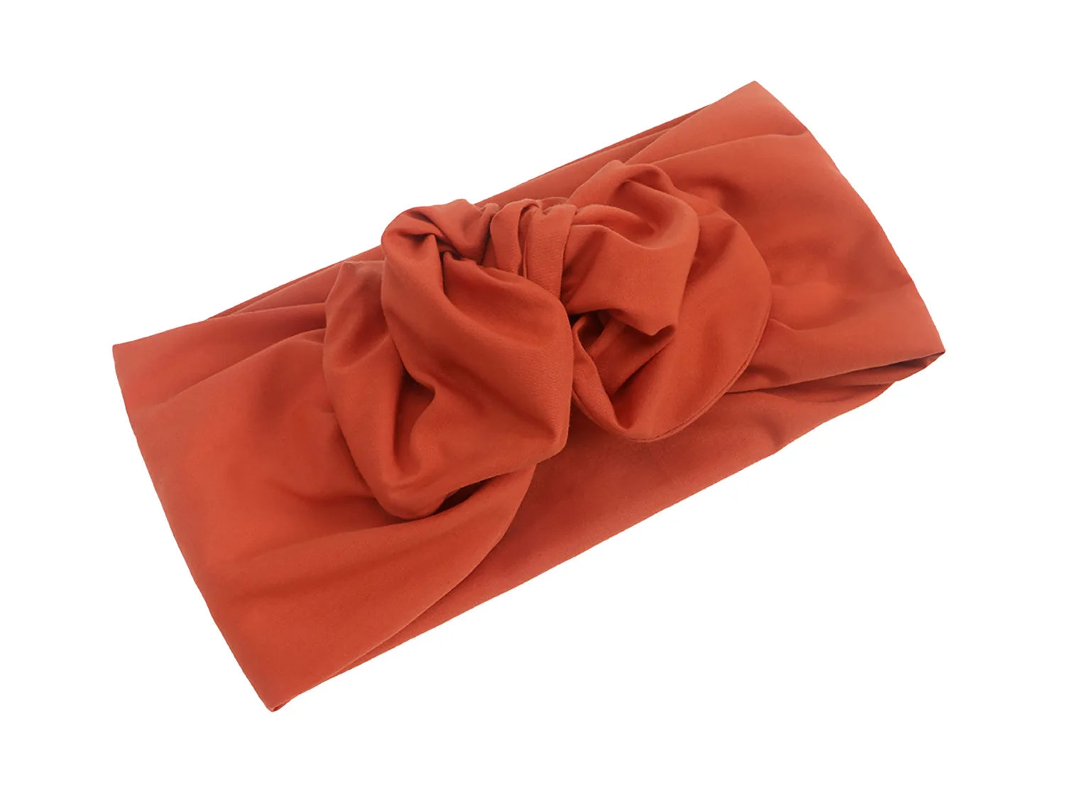 Terracotta-coloured turban headband in a soft, vintage-style knotted design.