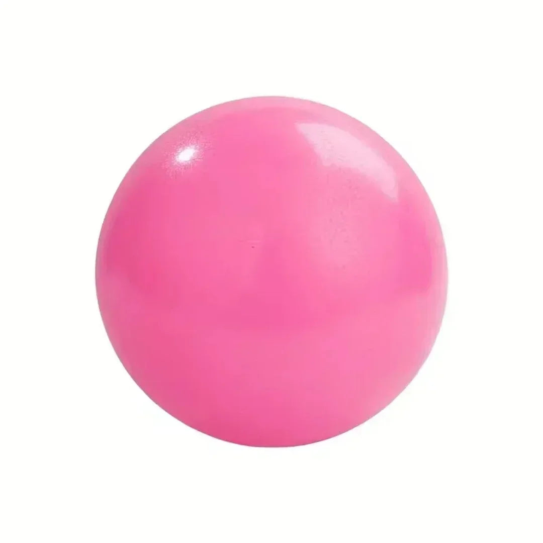 A smooth, glossy hot pink ball isolated against a plain white background.