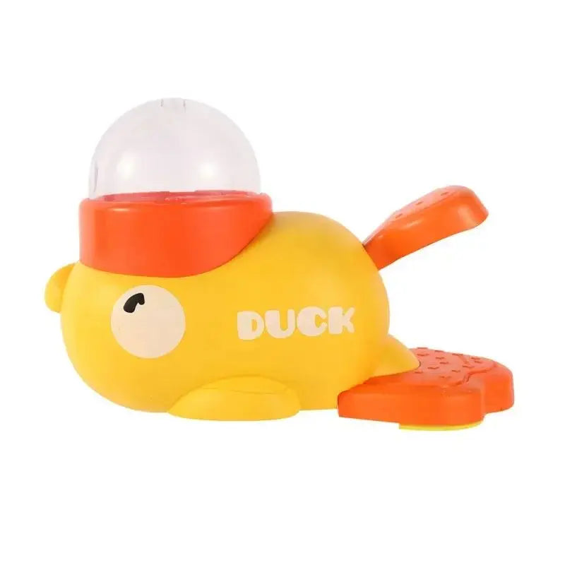 Yellow and orange duck-shaped interactive dog toy with a clear dome top and textured orange tail.