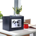 Black metal safe with a silver door, digital keypad, and key lock, sitting on a white desk.