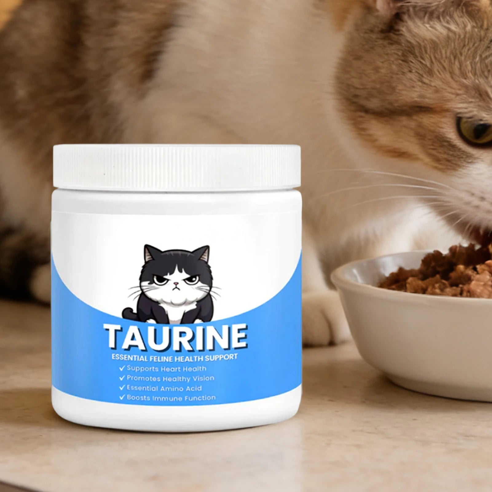 White tub of feline taurine supplement with a blue label, illustrated cat graphic, and health benefit bullet points.