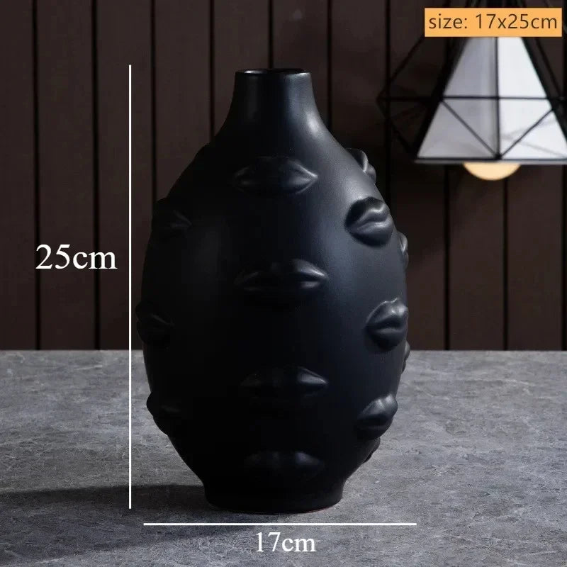 Matte black decorative vase, 25cm tall, featuring a unique 3D embossed lip pattern for a modern, artistic look.