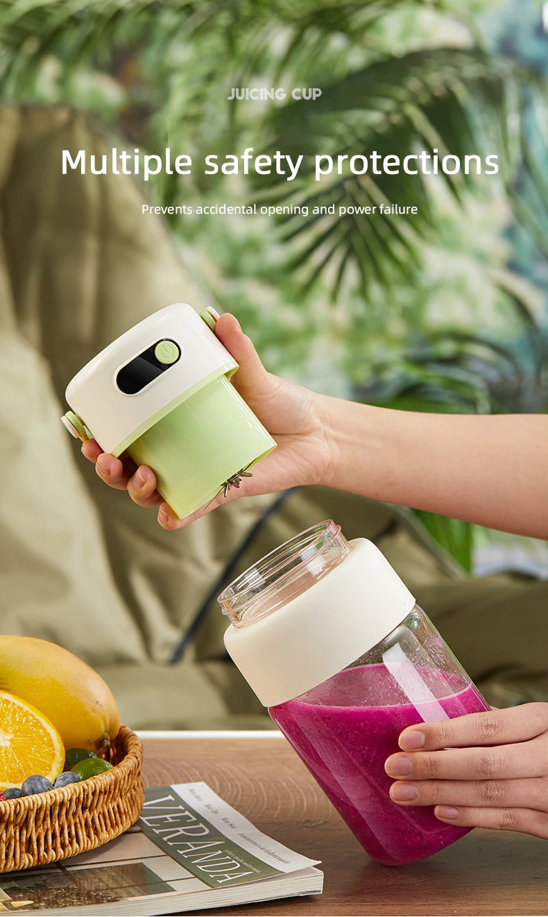Portable personal blender in cream and pastel green, featuring a glass cup filled with pink smoothie.