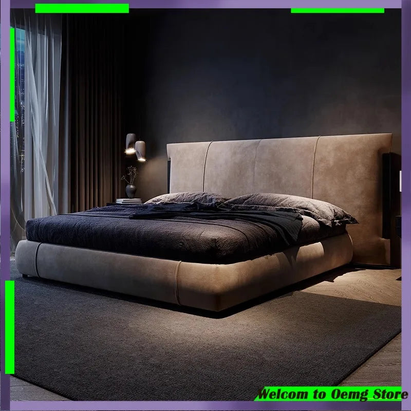 Luxurious Nordic-style double bed in beige upholstered fabric with a wide, panelled headboard in a dark bedroom.