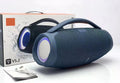 Blue portable 100W waterproof Bluetooth speaker with a carry handle and colourful circular RGB side lighting.