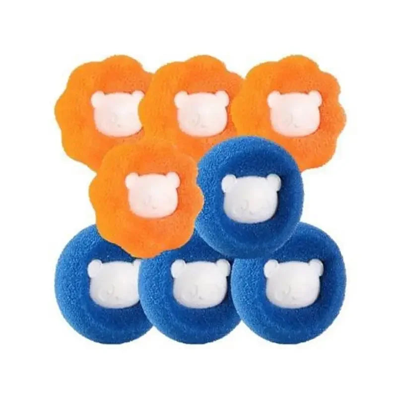 A group of orange and blue fuzzy circular hair scrunchies, each featuring a central white bear-shaped charm.