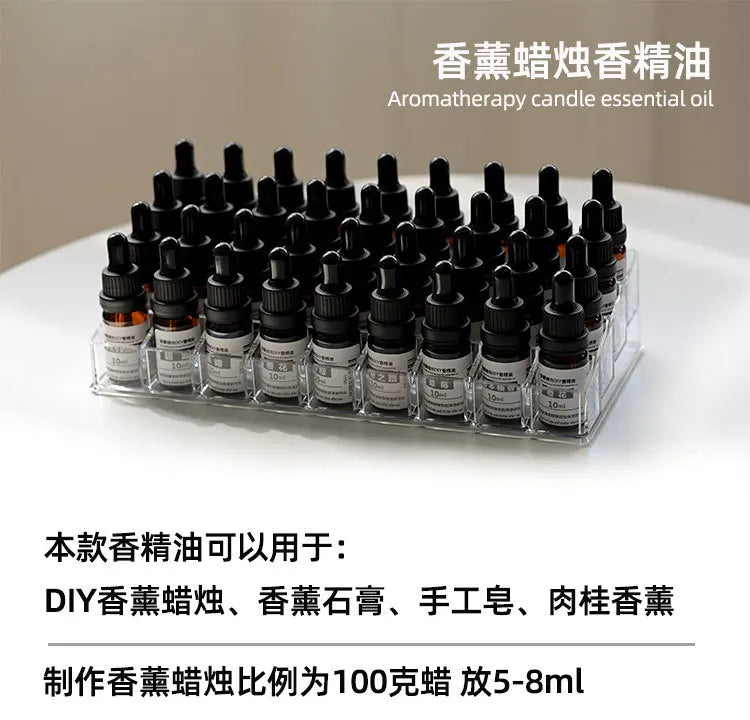 Collection of small 10ml amber glass essential oil dropper bottles stored in a clear acrylic organiser tray.