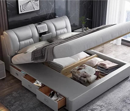 Light grey king size upholstered storage bed with lift-up base, integrated headboard shelving and side drawers.