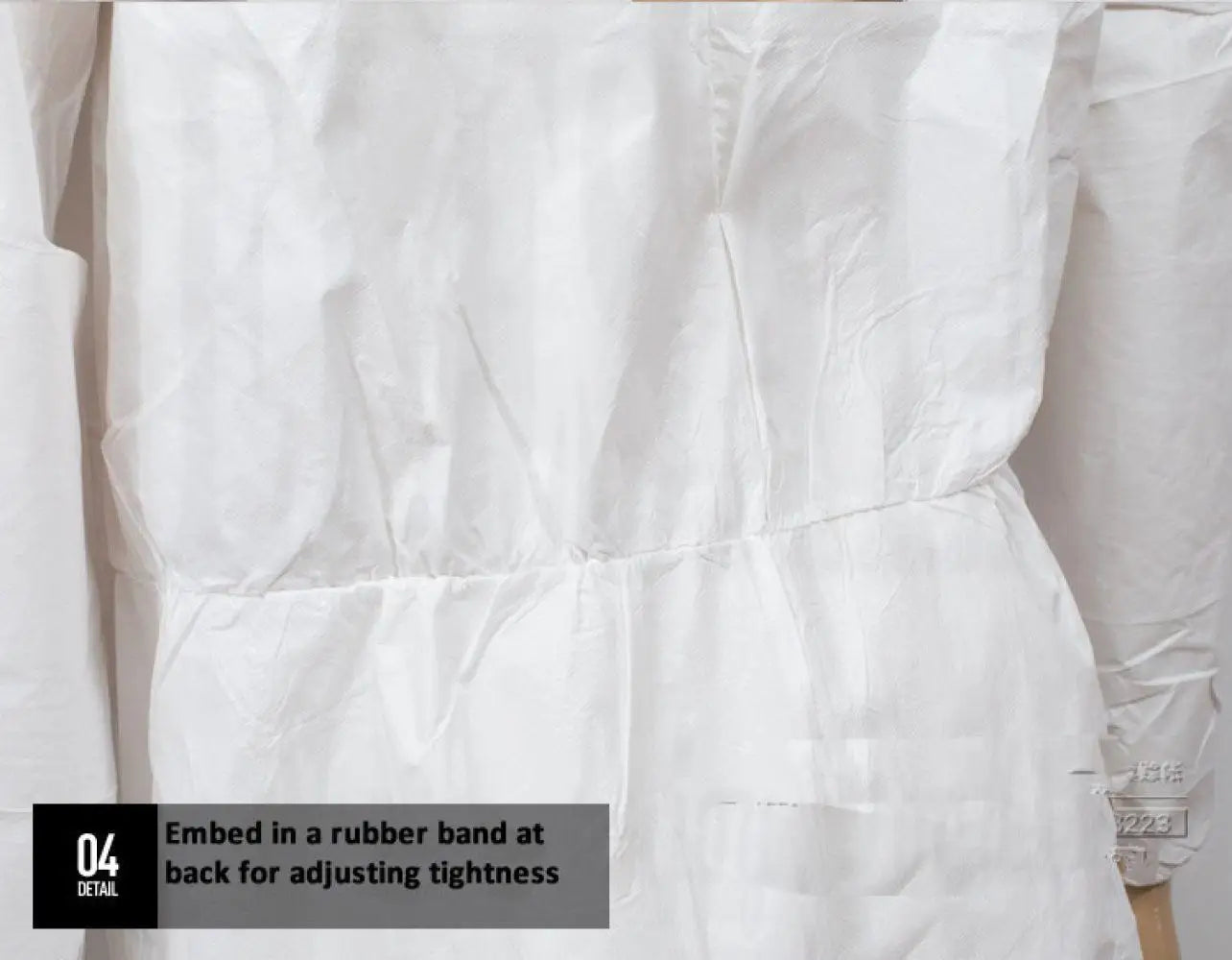 Close-up of a white protective suit with an elasticized waistband for an adjustable, snug fit.