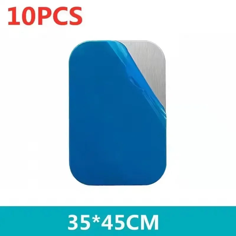10 rectangular metal plates with rounded corners, partially covered by a protective blue film. 35x45cm size.