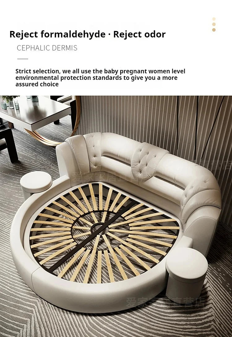 Modern cream-coloured round double bed featuring a tufted leather backrest, wooden slatted base, and side stools.