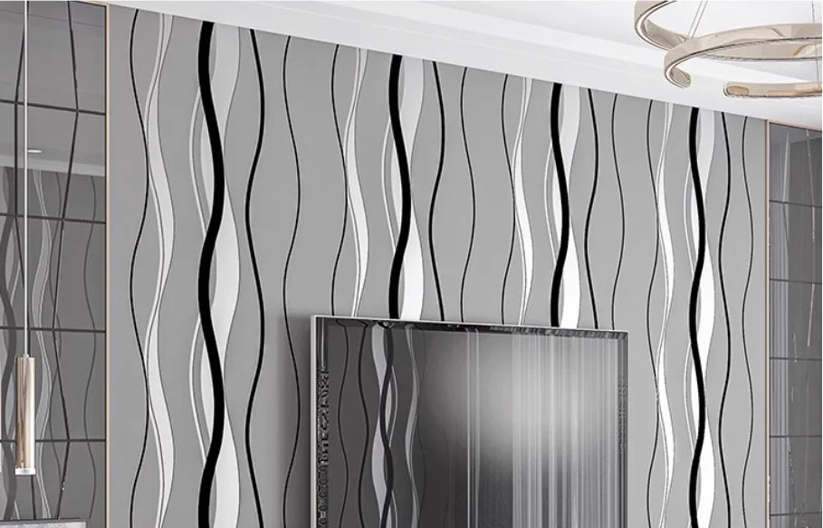 Modern grey wallpaper featuring vertical, flowing black and white wavy stripes on a smooth matt background.