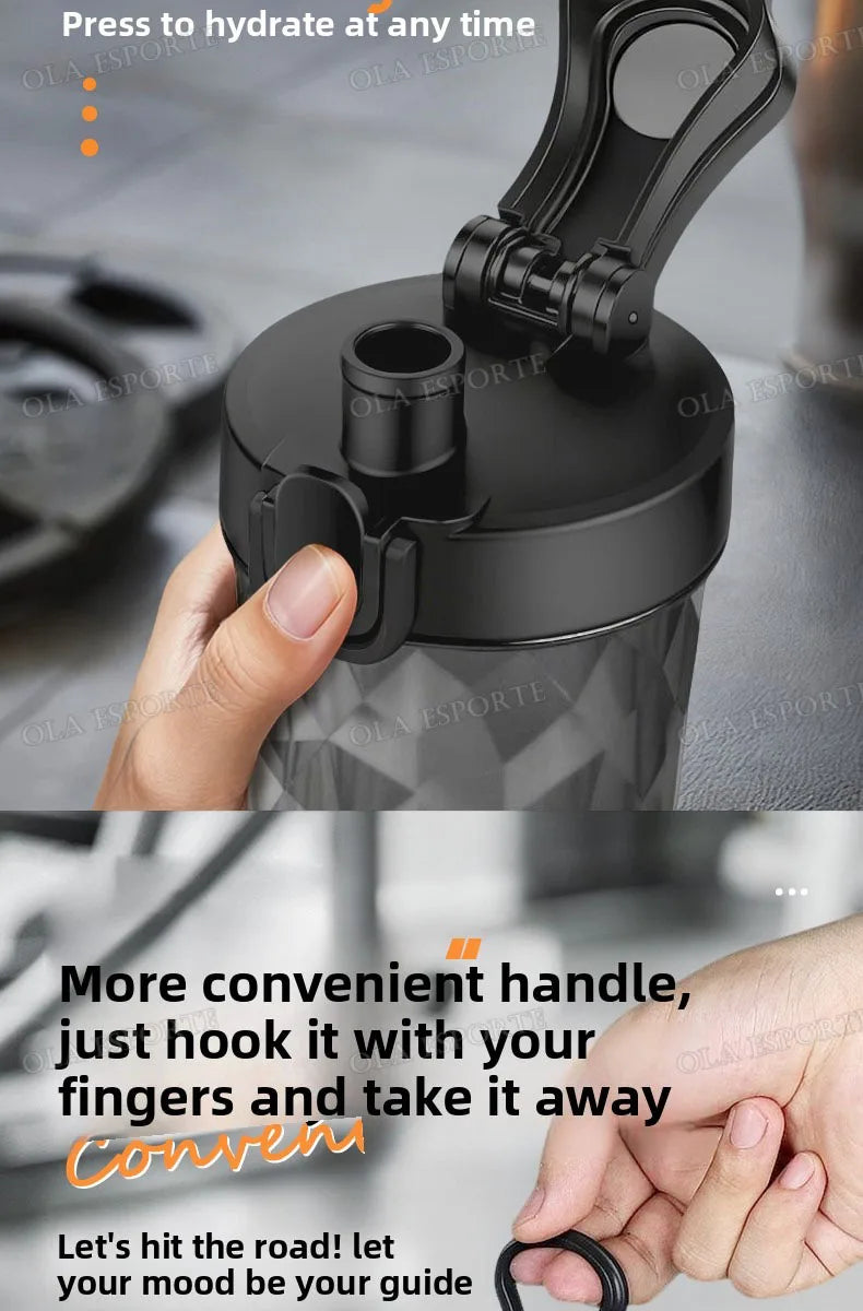 Black sports water bottle with a flip-top lid, straw, and integrated finger-loop carry handle.